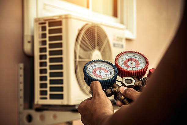 Professional Air Conditioning Service technician working in Dunbar, KY